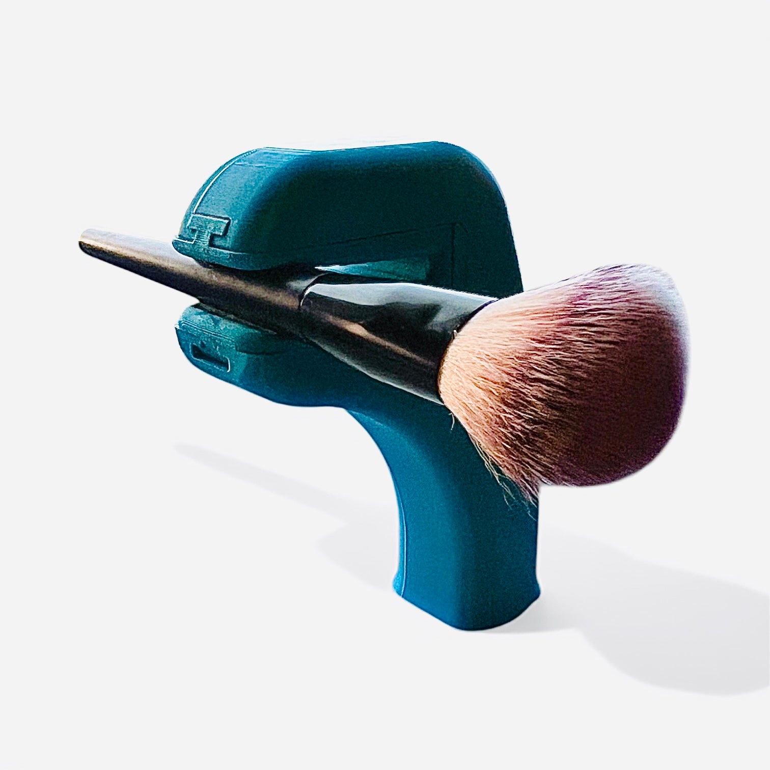 The Helping Hand holding a brush