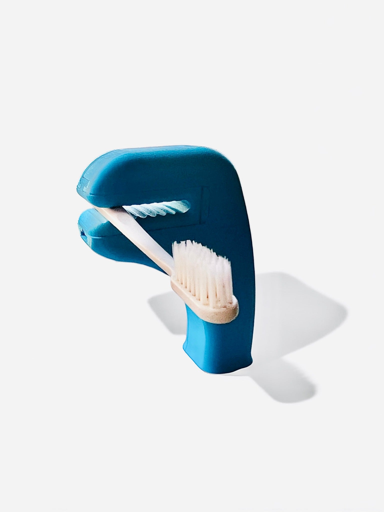 The Helping Hand holding a toothbrush